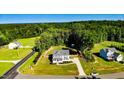 Beautiful aerial view of the home, highlighting its wooded surroundings at 2802 Bingham Dr, Mebane, NC 27302
