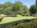 Picture of a well-manicured front lawn with garden and shrubbery at 2909 Sprucewood Dr, Durham, NC 27707