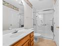Bright bathroom with shower, white fixtures, framed mirror, and floral wallpaper border at 3027 Maple # T1, Burlington, NC 27215
