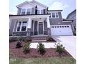 Charming two-story house features a modern exterior, well-kept landscaping, and a spacious two-car garage at 3500 Bailey Lake Dr, Fuquay Varina, NC 27526
