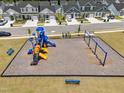 Aerial view of community playground with colorful slides, swings, and surrounding neighborhood homes at 445 Sturgeon St, Smithfield, NC 27577