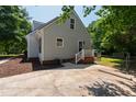 Home exterior featuring a patio area, well-maintained lawn, and white railing at 5413 Lower Creek Ct, Apex, NC 27539