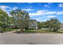 View of home with landscaped front yard and sidewalks in a suburban neighborhood at 6221 Winter Spring Dr, Wake Forest, NC 27587