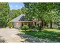 Well-maintained home with an attached garage and meticulously landscaped yard at 65 Georgetown Woods Dr, Youngsville, NC 27596