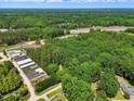 Aerial view of wooded acreage with potential for various uses at 9257 Sauls Rd, Raleigh, NC 27603