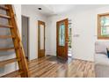 Bright foyer features hardwood floors and a decorative front door at 9507 Sertoma Rd, Chapel Hill, NC 27516