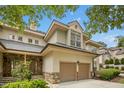 Two-story home featuring stone accents, a two-car garage, and mature trees at 95113 Vance Knls, Chapel Hill, NC 27517