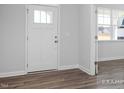 Entryway showcasing stylish flooring and a glimpse into a sunlit room at 98 Priming Way, Angier, NC 27501