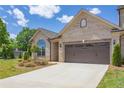 Attractive brick home offering a two-car garage, a spacious driveway, and lovely curb appeal at 1041 Bonanza Ln # 37, Mebane, NC 27302