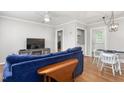 Comfortable living room with hardwood floors and stylish blue sofa at 1400 Roslyn Dr # 17B, Burlington, NC 27215
