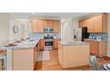 Well-equipped kitchen features stainless steel appliances, granite counters, and wood cabinets at 1504 Haventree Rd, Durham, NC 27713