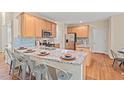 Stylish kitchen boasts a breakfast bar, stainless appliances, and ample counter space at 1504 Haventree Rd, Durham, NC 27713