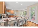 Bright kitchen offers stainless steel appliances, granite countertops, and breakfast nook at 1504 Haventree Rd, Durham, NC 27713