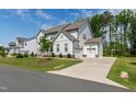 Beautiful home with a two-car garage, well-maintained lawn, and inviting curb appeal in a friendly neighborhood at 1928 Vandiver Way, Apex, NC 27523