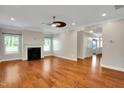 Bright living room with hardwood floors and fireplace at 20 Sugarpine Trl, Clayton, NC 27520