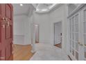 Bright foyer featuring tile flooring and a decorative column at 2312 Shallowford Ln, Chapel Hill, NC 27517