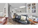 This living room features comfortable seating, decor, and a view to the second story at 2910 Barrymore St # 100, Raleigh, NC 27603