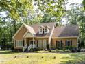 Charming single-Gathering home featuring dormer windows and a landscaped front yard at 301 Monterey Ct, Benson, NC 27504