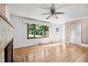 Bright and airy living room with hardwood floors and a cozy fireplace at 330 Wilmot Dr, Raleigh, NC 27606