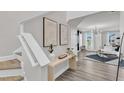 Inviting entryway with modern decor, a stylish table, and views into a bright and spacious living area at 520 Oak Holly Ln, Zebulon, NC 27597