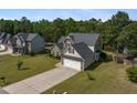 Beautiful home with a two-car garage, manicured lawn, and a lovely neighborhood setting at 550 Spring Flowers Dr, Cameron, NC 28326