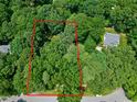 Aerial view of tree-covered property lines, highlighting the boundaries of the secluded lot at 608 Misty Isle Pl, Raleigh, NC 27615