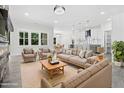 Bright living room featuring modern furniture, large windows, and an open concept layout at 107 Mohave Dr, Louisburg, NC 27549