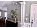 Charming foyer featuring decor details, granite-topped cabinet, and neutral grey walls at 126 Willow Weald Ct, Fuquay Varina, NC 27526