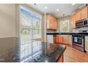 This bright kitchen features modern stainless appliances and granite countertops; the perfect space for cooking and entertaining at 127 Bobwhite Way, Mebane, NC 27302