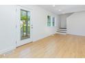 Bright and airy living room featuring light wood floors, white walls, and natural light at 1605 Bobwhite Ln, Rocky Mount, NC 27804
