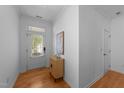 Bright entryway featuring hardwood floors and an accent cabinet at 2057 Tanners Mill Dr, Durham, NC 27703