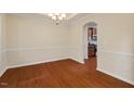 Dining room with hardwood floors, and an elegant chandelier, perfect for Gathering gatherings at 210 Strolling Way, Durham, NC 27707