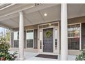 Inviting front door with a decorative wreath and sidelight windows at 2122 Aventon Ln, Morrisville, NC 27560