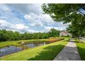 Scenic view of the community pond, complete with lush greenery at 337 Botan Way, Hillsborough, NC 27278