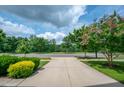 Pleasant street view showcasing the neighborhood's well-maintained sidewalks and landscaping at 337 Botan Way, Hillsborough, NC 27278