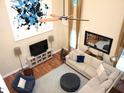 Bright living room with soaring ceilings, a cozy sectional, and modern decor at 3650 Pleasants Ridge Dr, Wake Forest, NC 27587