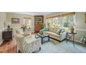 Bright living room with hardwood floors, neutral walls, and plenty of natural light at 4021 Converse Dr, Raleigh, NC 27609