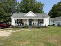 Exterior view of a home with a covered porch and a yard, requiring some tidying at 429 5Th & Brogden Rd, Smithfield, NC 27577
