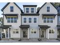 Stylish townhomes featuring diverse color schemes and modern designs creating a visually appealing neighborhood at 4821 Gossamer Ln # 102, Raleigh, NC 27616