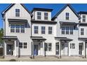 Charming townhome with light siding, black trim, and inviting entrance, perfect for modern living at 4821 Gossamer Ln # 103, Raleigh, NC 27616