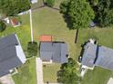 Overhead view of a house with a spacious, fenced backyard and a wooden deck at 5529 Wood Pond Ct, Raleigh, NC 27610