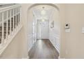Bright foyer with chandelier and hardwood floors at 5936 Hourglass Ct, Raleigh, NC 27612