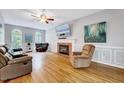 Spacious living room with fireplace, hardwood floors, and comfortable seating at 838 Joyner Ct, Wake Forest, NC 27587