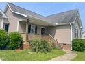 A lovely porch welcomes you to the home at 101 Langston Ridge Dr, Angier, NC 27501