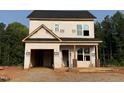 New construction home with exposed framing showcases future living spaces at 103 Goldenrod Loop, Clayton, NC 27520