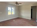 Spacious living room with a large window, providing ample natural light at 1036 Turlington Rd, Dunn, NC 28334