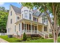 Charming home exterior with a cozy front porch, manicured landscaping, and welcoming curb appeal at 121 Fort Jackson Rd, Morrisville, NC 27560