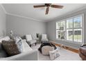 Bright living room with a ceiling fan, comfortable seating, and lots of natural light at 1731 Malone Rd # A, Burlington, NC 27215