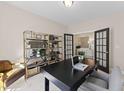Bright office with double french doors, bookcase, and desk with chairs at 2012 Kapalua Way # 193, Durham, NC 27703