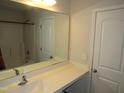 Well-lit bathroom featuring a large mirror, vanity with sink, and shower-tub combination at 2039 Alderman Way, Creedmoor, NC 27522